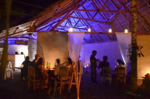a group of people sitting at a table in a tent at Kapievi Ecovillage in Puerto Maldonado +60 photos