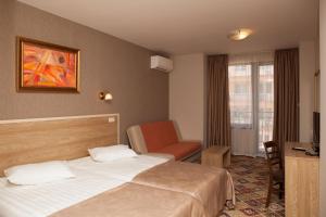 A bed or beds in a room at Hotel Motto