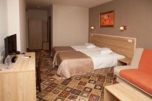 A bed or beds in a room at Hotel Motto