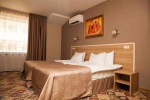 A bed or beds in a room at Hotel Motto