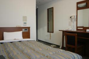 Posteľ alebo postele v izbe v ubytovaní Hotel Route-Inn Mojiko