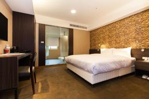 Giường trong phòng chung tại Fairytale Yi Su Hotspring Hotel