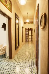 
a room with a door leading to a hallway at The Ivy House in Kolkata

