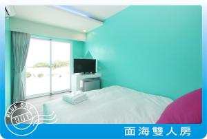 TV a/nebo společenská místnost v ubytování Kenting Blue Bay Inn + 11 fotografií