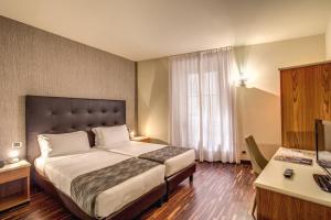 Una cama o camas en una habitación de Albergo Firenze
