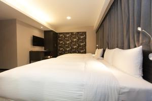 Giường trong phòng chung tại Fairytale Yi Su Hotspring Hotel