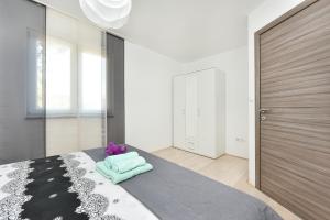 Ein Bett oder Betten in einem Zimmer der Unterkunft Apartman Kresan