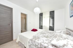 Ein Bett oder Betten in einem Zimmer der Unterkunft Apartman Kresan