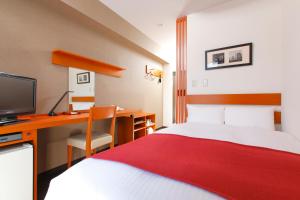 
Tempat tidur dalam kamar di HOTEL MYSTAYS Kameido
