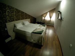 Postel nebo postele na pokoji v ubytování Hotel Imperial