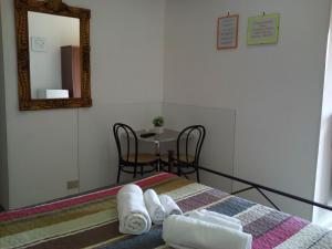 A bed or beds in a room at B&B La Cubanina