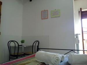 A bed or beds in a room at B&B La Cubanina