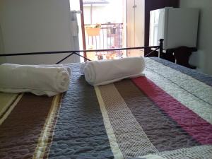 A bed or beds in a room at B&B La Cubanina