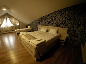 Postel nebo postele na pokoji v ubytování Hotel Imperial