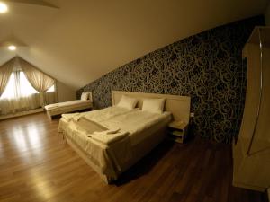 Postel nebo postele na pokoji v ubytování Hotel Imperial