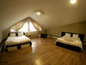 Postel nebo postele na pokoji v ubytování Hotel Imperial