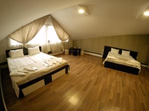 Postel nebo postele na pokoji v ubytování Hotel Imperial