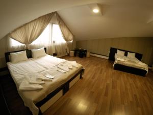 Postel nebo postele na pokoji v ubytování Hotel Imperial