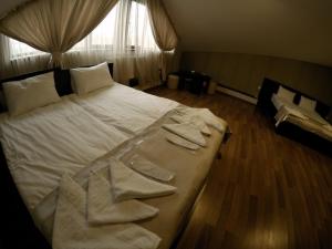 Postel nebo postele na pokoji v ubytování Hotel Imperial