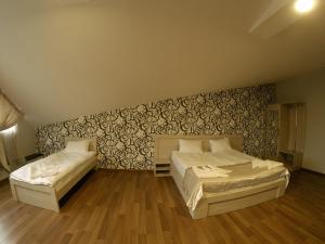 Postel nebo postele na pokoji v ubytování Hotel Imperial
