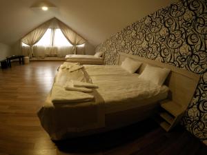 Postel nebo postele na pokoji v ubytování Hotel Imperial