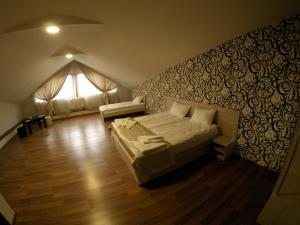 Postel nebo postele na pokoji v ubytování Hotel Imperial