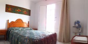 Postel nebo postele na pokoji v ubytování Duplex Turisticos MojaMar Playa