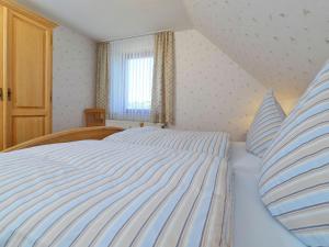 Ein Bett oder Betten in einem Zimmer der Unterkunft Apartment in Eimelrod with Panoramic Views