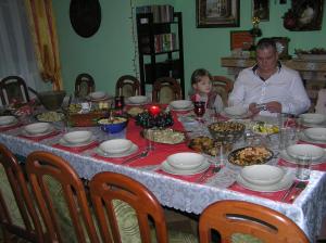 a man and a child sitting at a table with food at Willa Chatka Puchatka in Piechowice +40 photos