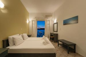 Posteľ alebo postele v izbe v ubytovaní Angeliki Seaside Hotel