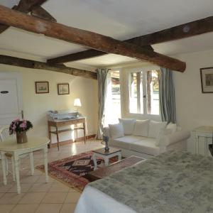 Ένα ή περισσότερα κρεβάτια σε δωμάτιο στο Domaine De La Mouthe