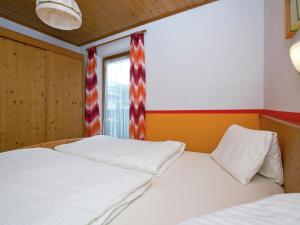a bedroom with two beds and a window at Plush Apartment in Altenmarkt im Pongau near Ski Area in Altenmarkt im Pongau