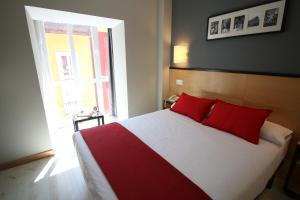 Postel nebo postele na pokoji v ubytování Hotel Alda Entrearcos