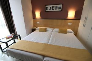 Postel nebo postele na pokoji v ubytování Hotel Alda Entrearcos