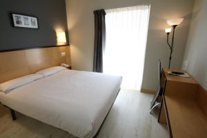 Postel nebo postele na pokoji v ubytování Hotel Alda Entrearcos