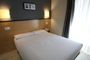 Postel nebo postele na pokoji v ubytování Hotel Alda Entrearcos
