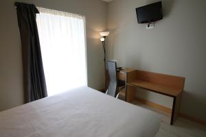 Postel nebo postele na pokoji v ubytování Hotel Alda Entrearcos