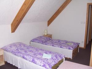 Postel nebo postele na pokoji v ubytování Penzion Restaurace Chanos