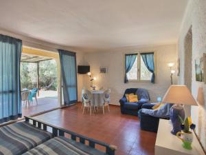 a living room with a couch and a table at Romantic Retreat in Cargèse in Cargèse