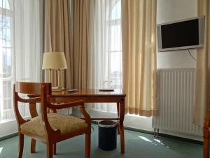 TV a/nebo společenská místnost v ubytování Hotel Goldener Anker