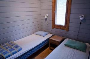 Una cama o camas en una habitación de Riihivuoren Lomakylä