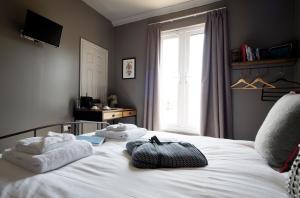 A bed or beds in a room at The Duke William 