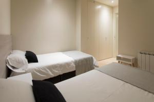 Posteľ alebo postele v izbe v ubytovaní Bravissimo Cort Reial-2A