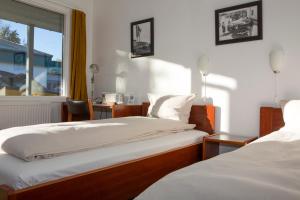 Ένα ή περισσότερα κρεβάτια σε δωμάτιο στο Wittrup Motel