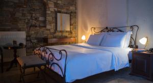 מיטה או מיטות בחדר ב-Evzin Hotel
