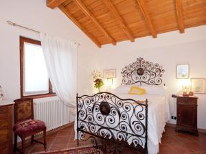 A bed or beds in a room at Holiday Home in Vezzi Portio with Pool