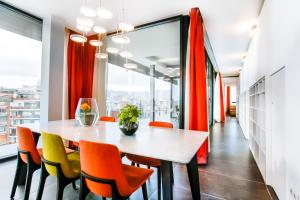 
a dining room table and chairs in a room at Cosmo Apartments Sants in Barcelona
