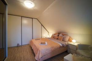 Postel nebo postele na pokoji v ubytování Bluestars Apartments