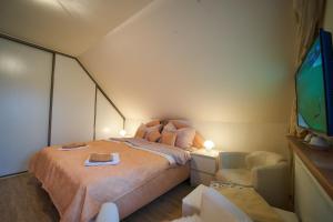 Postel nebo postele na pokoji v ubytování Bluestars Apartments