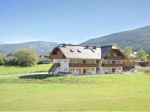a large house in the middle of a field at Apartment in St Margarethen in the ski area in Sankt Margarethen im Lungau